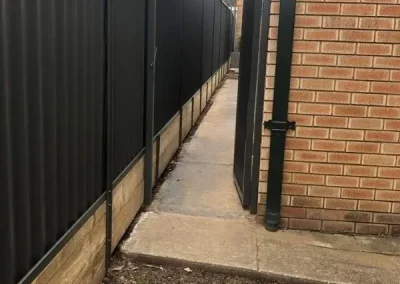 Colorbond fence with timber retaining wall Rockdale