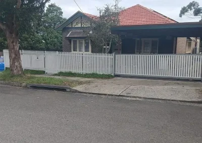 timber picket fence with sliding electric aluminum gate St George