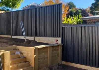 ongoing colorbond fence installation in Lugarno residential home